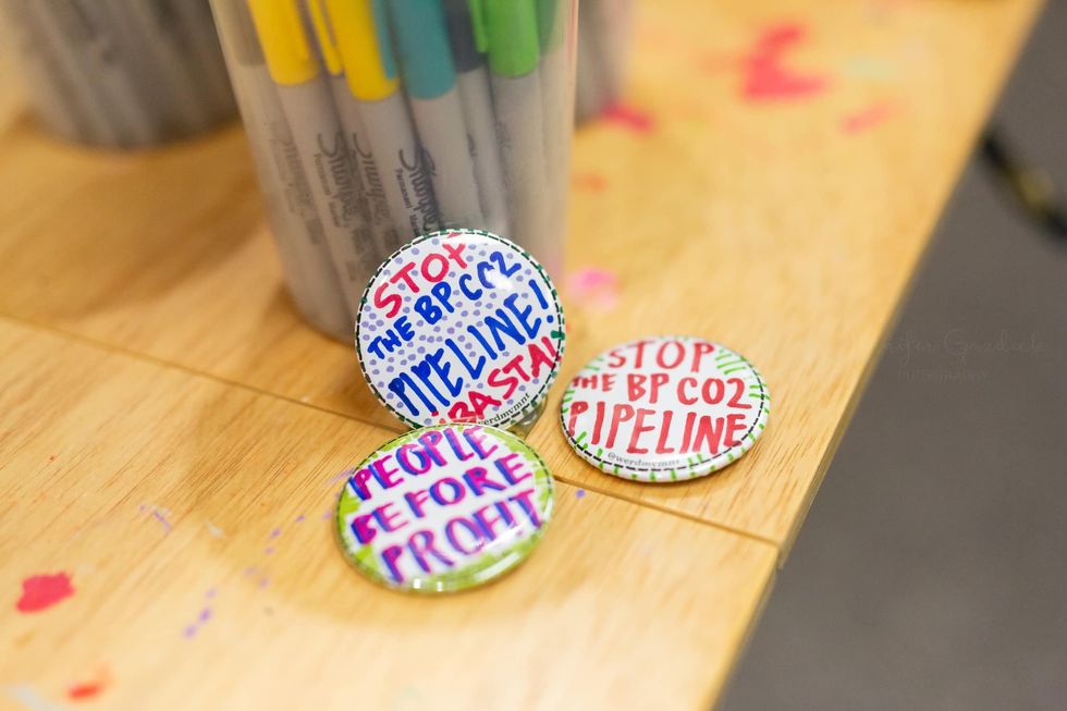 buttons protesting the BP CO2 pipeline