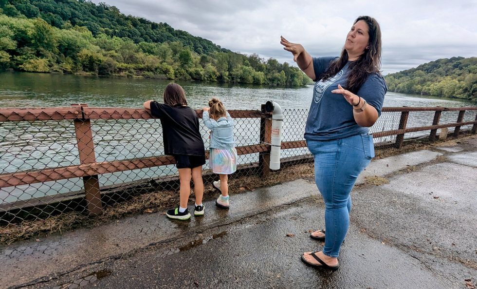 Pennsylvania activist Veronica Coptis with her two children near a river